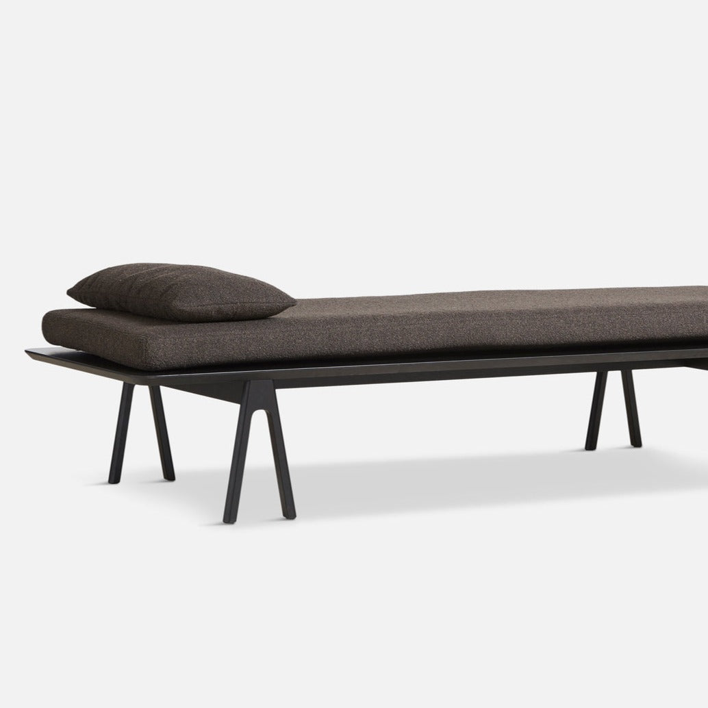 level daybed dark brown bouclé & black by woud at adorn.house