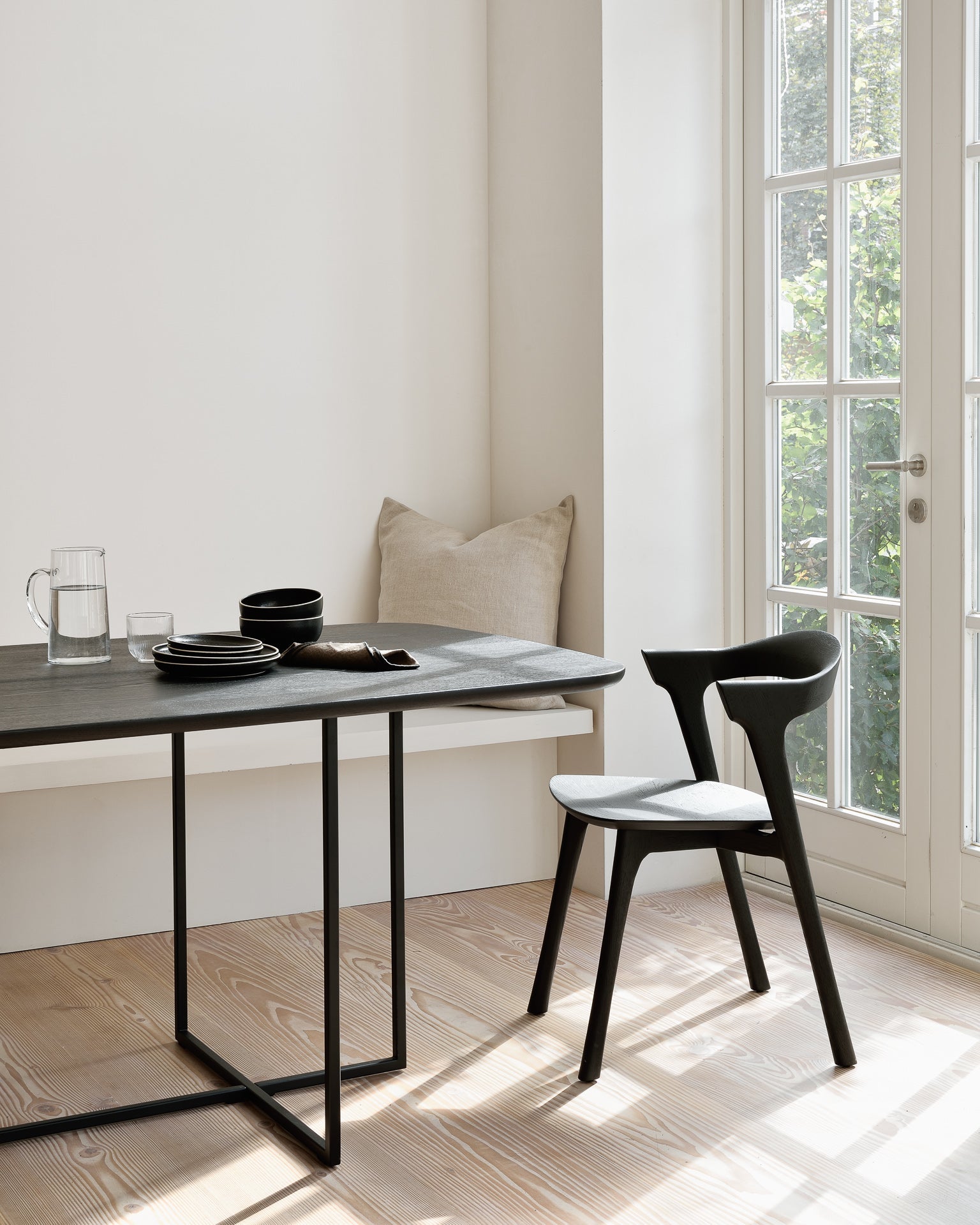 arc dining table by ethnicraft at adorn.house