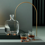 camp whisky bottle with brass base by nude at adorn.house