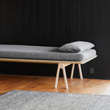 level daybed grey bouclé & oak by woud at adorn.house