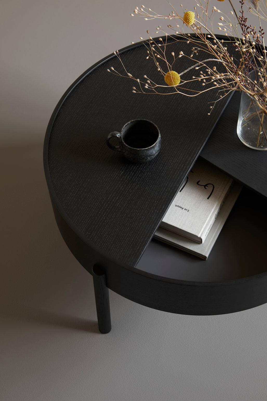 arc coffee table (66 cm) - black by woud at adorn.house