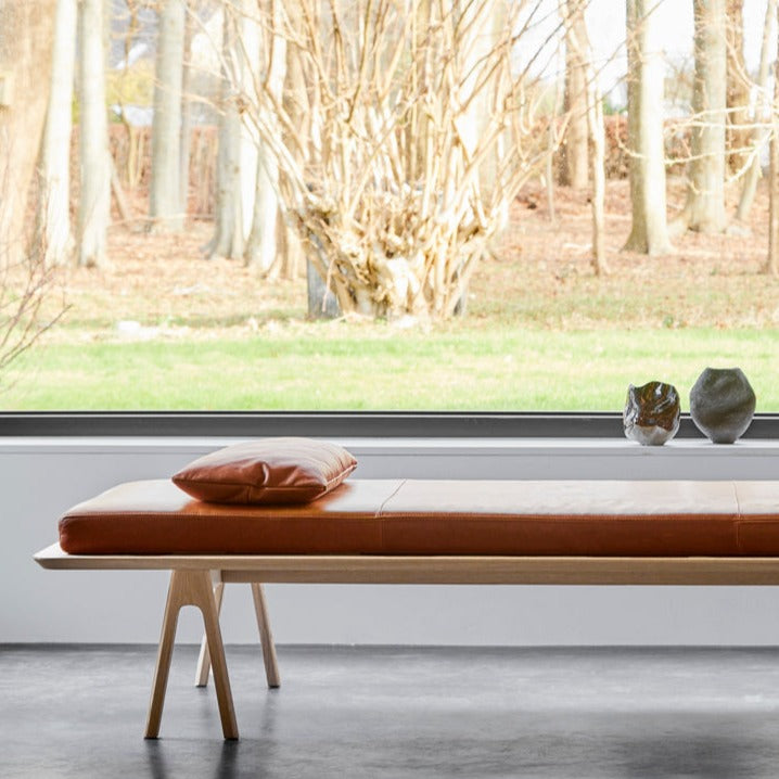 level daybed cognac/oak by woud at adorn.house